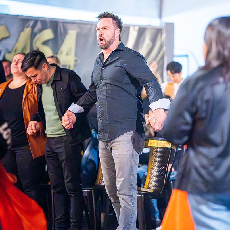 Troy Brave praying during a revival service