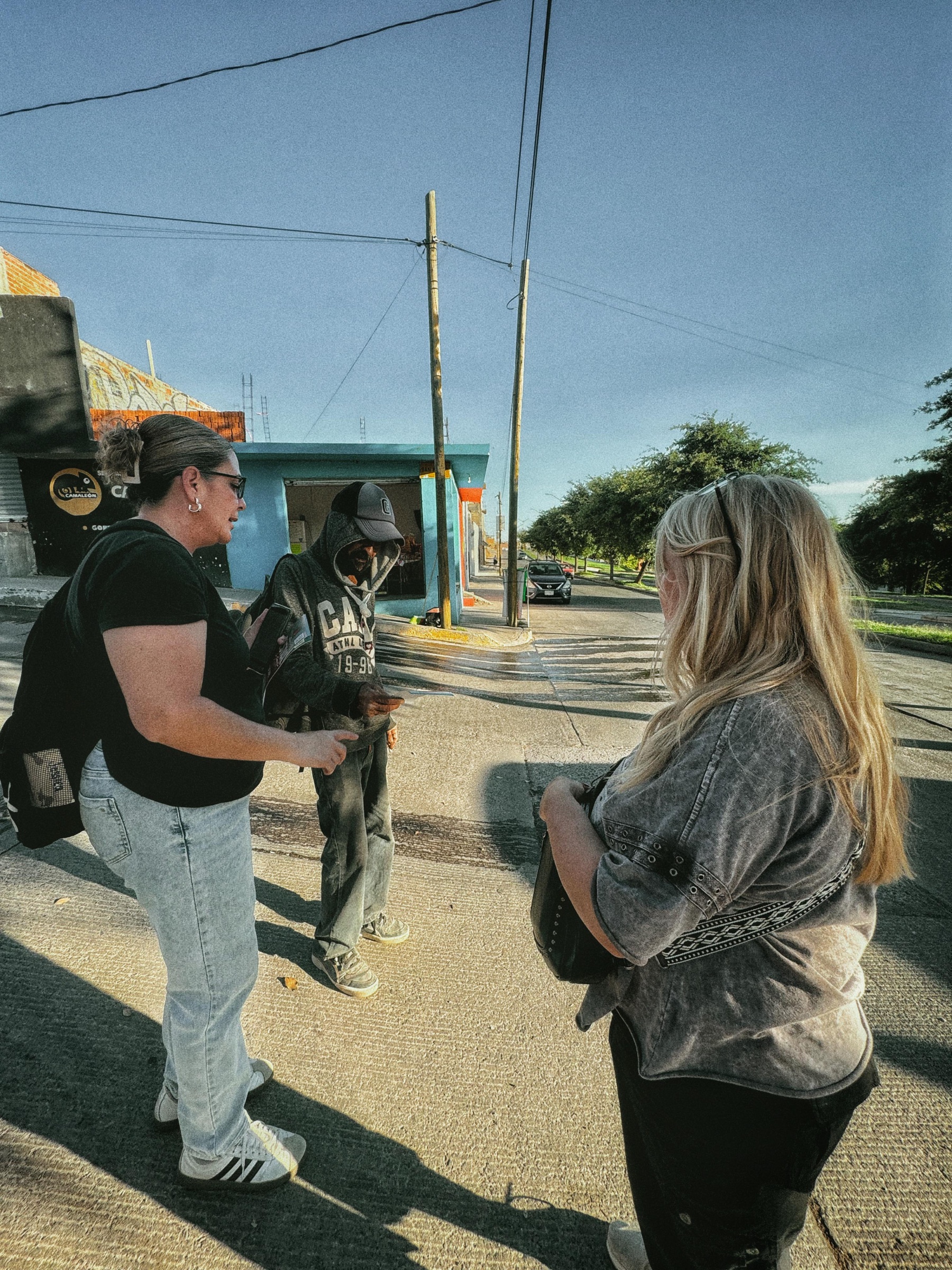 Sarah Brave speaking with people during soul winning outreach in Mexico